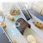 A small guinea pig rests on a white quilted cooling mat inside a pet enclosure, with a woven cool-down tunnel placed over its body. The image includes text explaining the cooling method and a visible Ozzy Pets logo in the top right.
